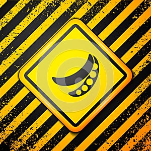 Black Green peas icon isolated on yellow background. Warning sign. Vector