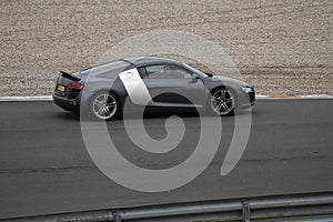 Black and grey Audi R8 riding on the circuit of Zandvoort in the Netherlands