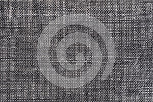 Black and grey denim background. Detailed texture of black and grey denim fabric