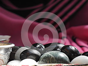 black and grey Shaligram stone on a temple shop photo