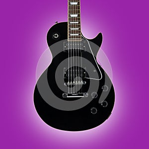 Black guitar isolated on pink eclipse background