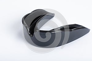 A black gumshield on a white background