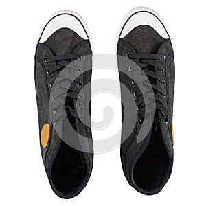 Black gumshoe isolated on white background. Stylish youth shoes