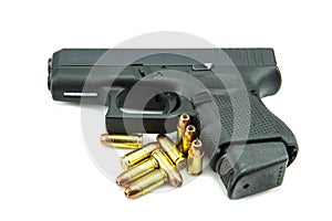 Black gun and 9mm bullets a white background