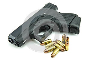 Black gun and 9mm bullets a white background