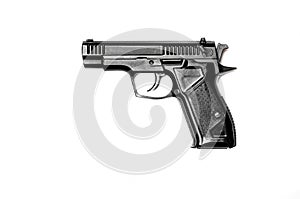 A black gun lies against a white background. . View from above. Close-up