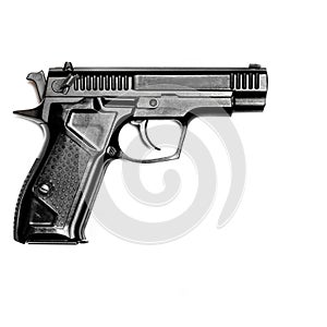 A black gun lies against a white background. . View from above. Close-up