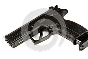 The black gun pistol on a white background close up.