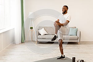 Black Guy Training Doing Legs Exercise Having Workout At Home