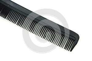 black hair comb isolated on white background photo