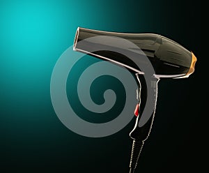 Black hair dryer on a dark background