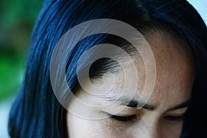 Black hair ,hairline and eyebrows of adult asian woman photo