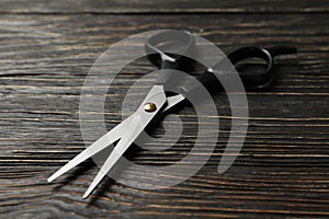 Black hairdresser scissors on background, close up