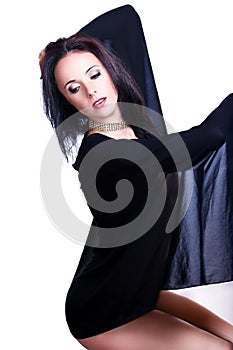 Black haired beautiful dancer covered by a see through material