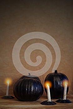 Black halloween pumpkins and candles