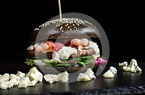 Black hamburger made from beef, with dor-blu-2