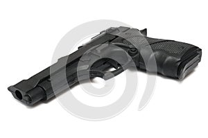 A black hammerless toy pistol against a white backdrop