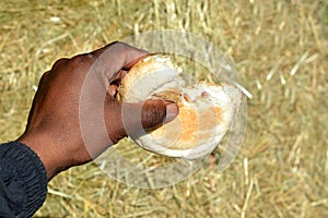 Black hand with bread