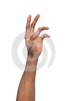 Hand of black man reaching virtual object, isolated on white photo