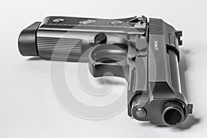 Black handgun on white background