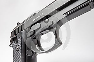 Black handgun on white background