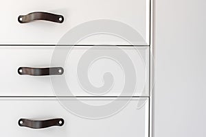 Black handles of the kitchen drawer or cabinet