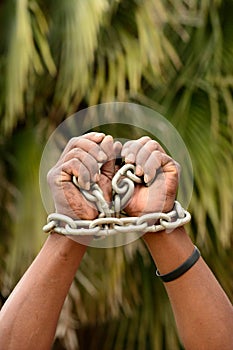 Black hands in chains