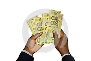 Black Hands in suit holding 10000 Burundian franc notes