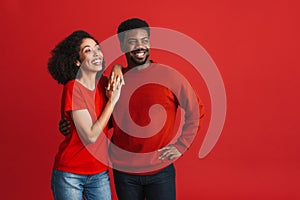 Black happy man and woman smiling and looking aside