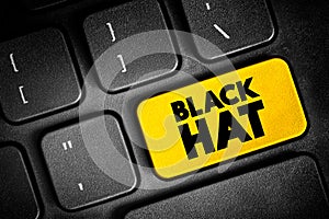 Black Hat is a hacker who violates computer security for their own personal profit or out of malice, text button on keyboard,
