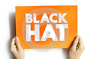 Black Hat is a hacker who violates computer security for their own personal profit or out of malice, text concept on card for