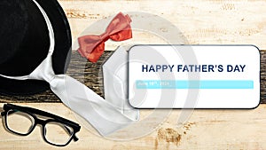 Black hat and red bow tie with eyeglasses with a Happy Father's Day message