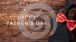 Black hat and red bow tie with a Happy Father\'s Day message