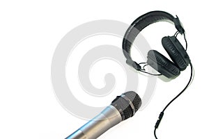 Black headphones and microphone isolated on white background