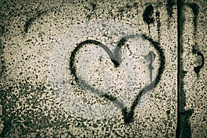 Black Heart painted on a concrete wall. Depression. Valentine`s day