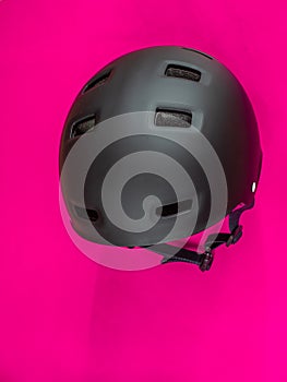 Black helmet on strong pink