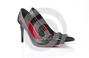 Black high heel women shoes with red sole and flounce isolated on white background photo