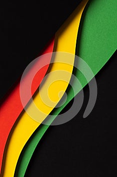 Black History Month color background. Abstract black, red, yellow, green color background with geometrical wavy lines