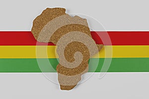 Black History Month concept. Africa Continent shape with traditional red, yellow and green color bar on white background.