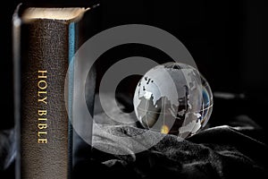 Black Holy Bible with Earth photo