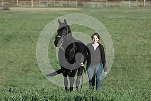 Black horse and woman