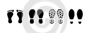 Black human footprints icon. Footstep print, shoe sole, footmarks. Track of shoes. Barefoot man\'s step. vector illustration photo