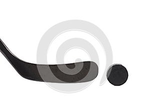 Black ice hockey stick and puck.