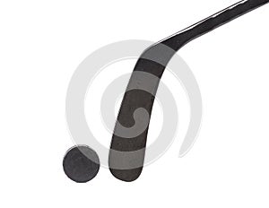 Black ice hockey stick and puck.