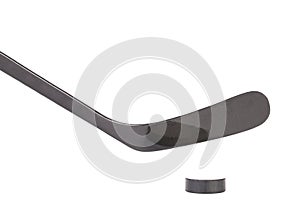 Black ice hockey stick and puck.