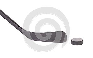 Black ice hockey stick and puck.