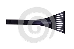 Black ice scraper on a white