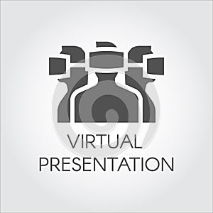 Black icon of people in virtual reality helmet. Concept of virtual presentation of future. Label drawn in flat design