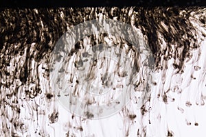 Black india ink in water