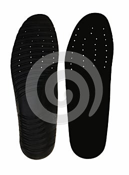 Black insoles for shoes on white background.